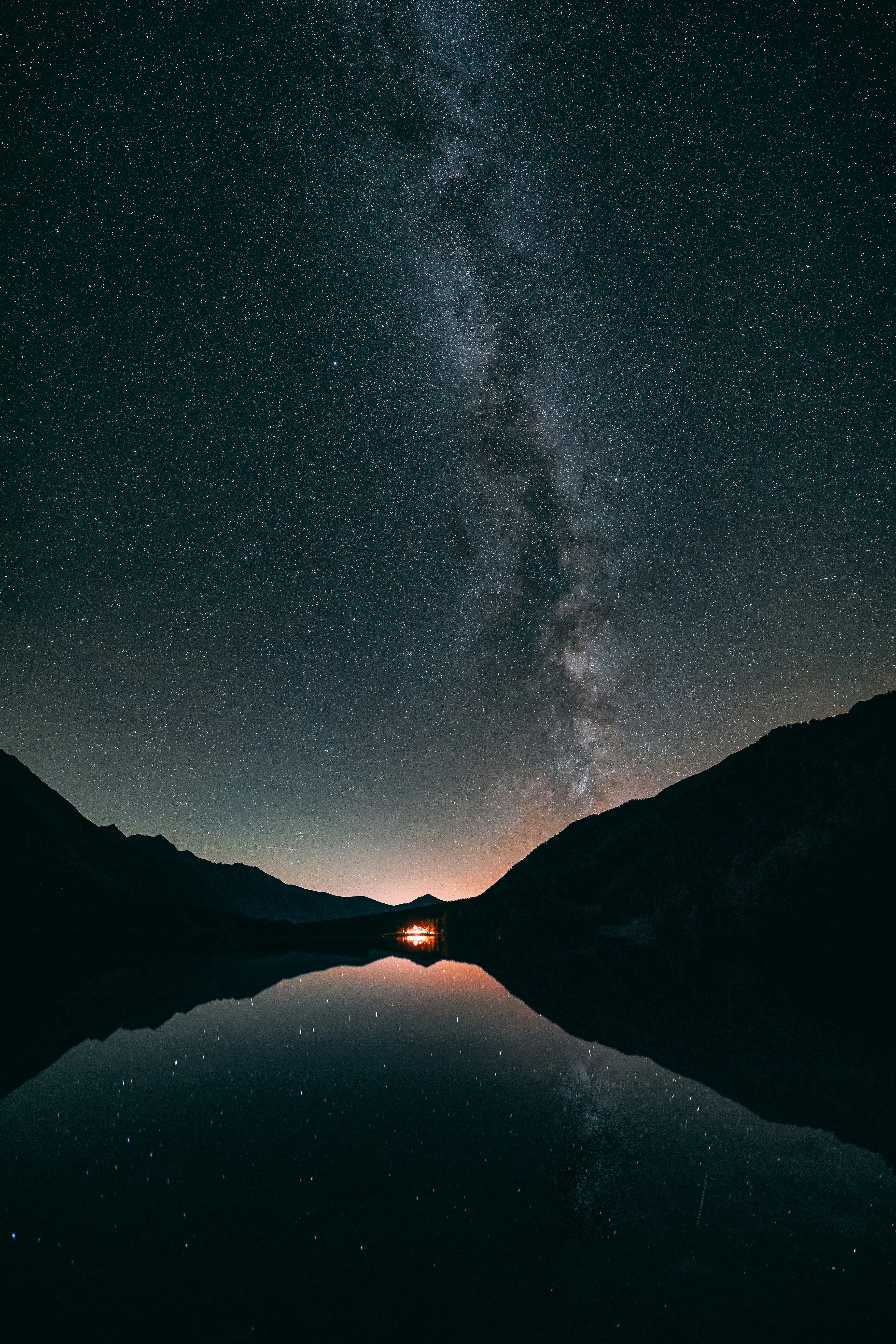 reflection photography of lake under black sky